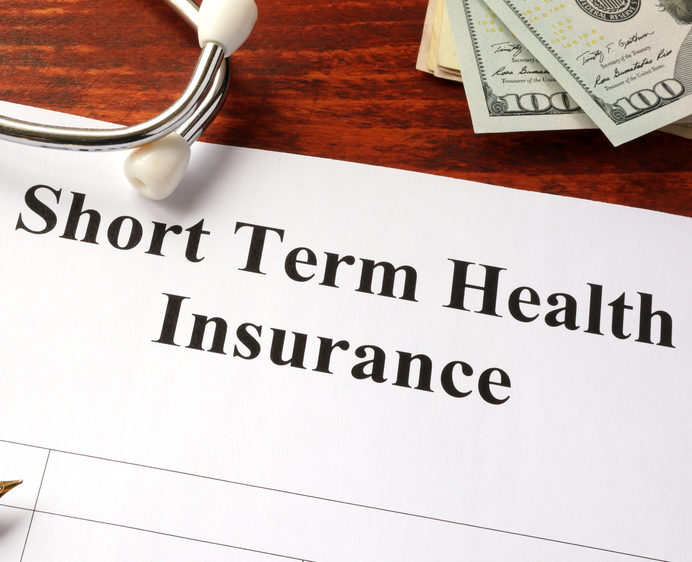 Short,Term,Health,Insurance,Policy,On,A,Table.